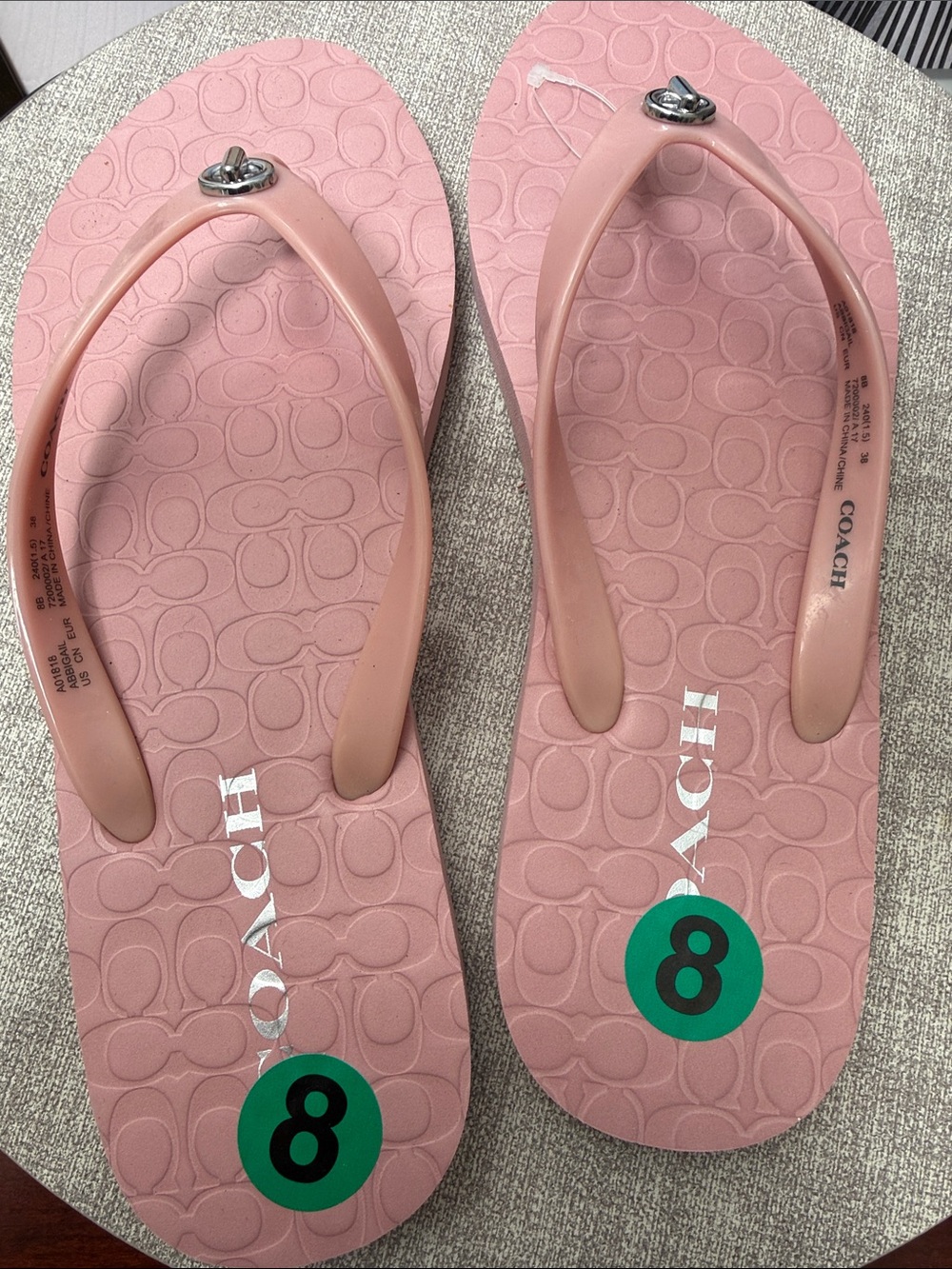 COACH Pink Logo Flip Flop Sandals with Silver Accent